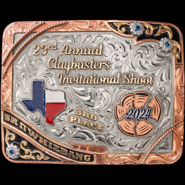 "The Ranger buckle is beautifully detailed with different elements and colors that will make this trophy buckle stand out at any event. Crafted on a hand engraved, German Silver base with a natural finish. Detailed with and engraved Copper edge, rope